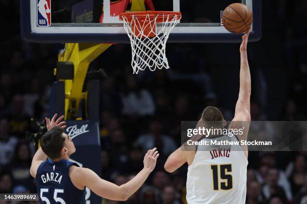 Nikola Jokic of the Denver Nuggets puts up a shot against Luka Garza of the Minnesota Timberwolves in the first quarter at Ball Arena on February 7,...