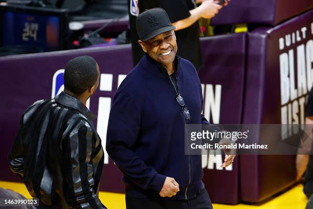 Rich Paul and Denzel Washington speak during the game between the Los Angeles Lakers and the Oklahoma City Thunder at Crypto.com Arena on February...