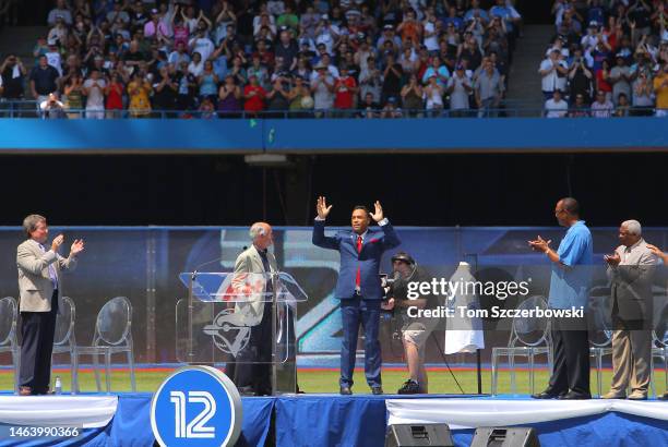 Former player Roberto Alomar of the Toronto Blue Jays acknowledges the ovation from the fans after having his number 12 retired in a ceremony before...