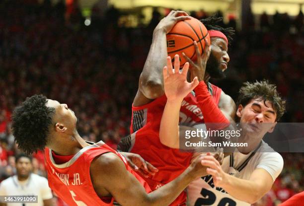 Morris Udeze of the New Mexico Lobos grabs a rebound against Daniel Foster of the Nevada Wolf Pack during the first half of their game at The Pit on...