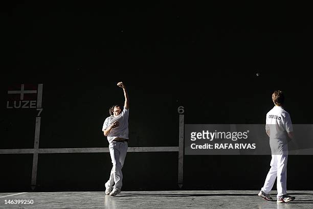 Young men play Basque traditional Esku Pilota , on June 15 at a court of the Northern Spanish Basque village of Orozko. AFP PHOTO/ RAFA RIVAS