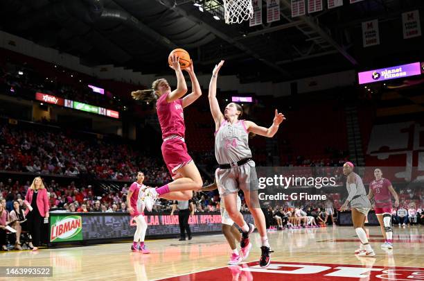 Abby Meyers of the Maryland Terrapins drives to the basket against Taylor Mikesell of the Ohio State Buckeyes at Xfinity Center on February 05, 2023...