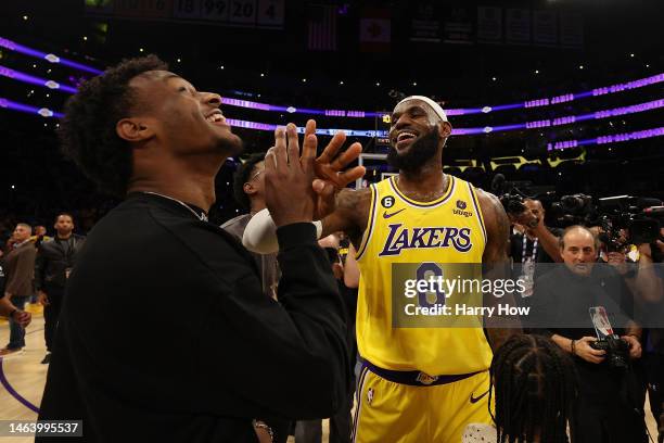 LeBron James of the Los Angeles Lakers reacts with Bronny James after scoring to pass Kareem Abdul-Jabbar to become the NBA's all-time leading...