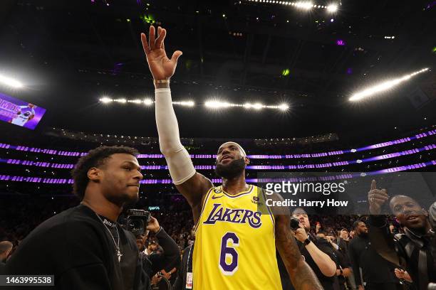 LeBron James of the Los Angeles Lakers reacts with Bronny James after scoring to pass Kareem Abdul-Jabbar to become the NBA's all-time leading...