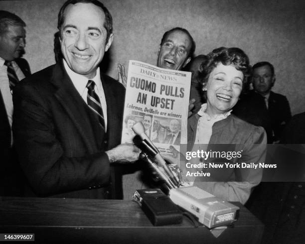 Holding up their favorite newspaper, Mario Cuomo and his wife, Matilda, celebrate his upset victory over Mayor Koch in the Democratic gubernatorial...