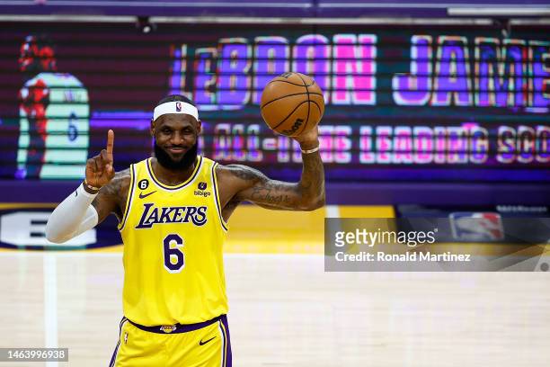 LeBron James of the Los Angeles Lakers addresses the crowd after scoring to pass Kareem Abdul-Jabbar to become the NBA's all-time leading scorer,...