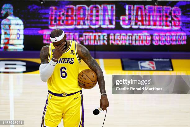 LeBron James of the Los Angeles Lakers addresses the crowd after scoring to pass Kareem Abdul-Jabbar to become the NBA's all-time leading scorer,...