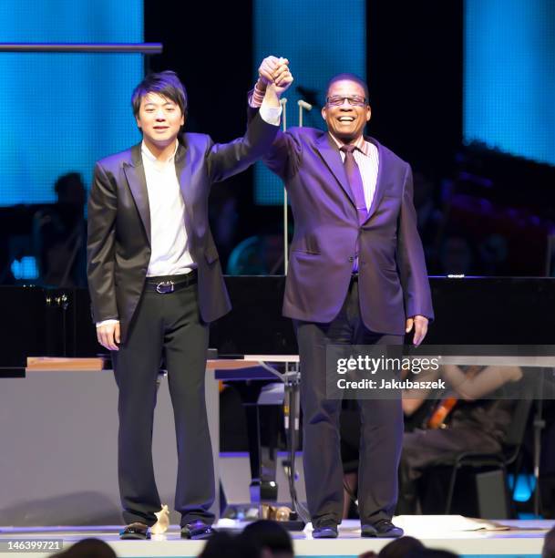 Chinese pianist Lang Lang and US pianist Herbie Hancock perform live during a concert at the O2 World on June 15, 2012 in Berlin, Germany.