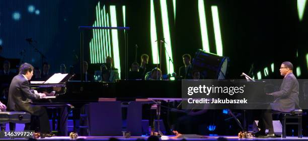 Chinese pianist Lang Lang and US pianist Herbie Hancock perform live during a concert at the O2 World on June 15, 2012 in Berlin, Germany.