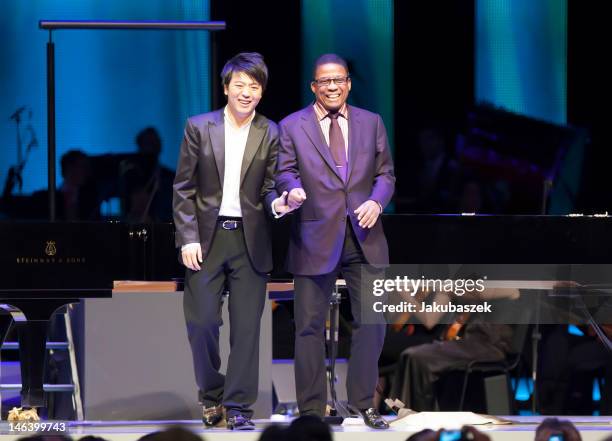 Chinese pianist Lang Lang and US pianist Herbie Hancock perform live during a concert at the O2 World on June 15, 2012 in Berlin, Germany.