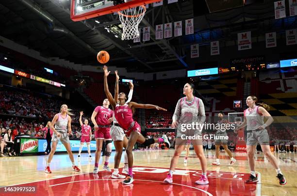 Diamond Miller of the Maryland Terrapins drives to the basket against Rebeka Mikulasikova of the Ohio State Buckeyes at Xfinity Center on February...