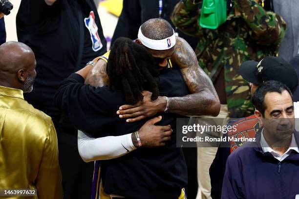 LeBron James of the Los Angeles Lakers celebrates with Jay-Z after scoring to pass Kareem Abdul-Jabbar to become the NBA's all-time leading scorer,...