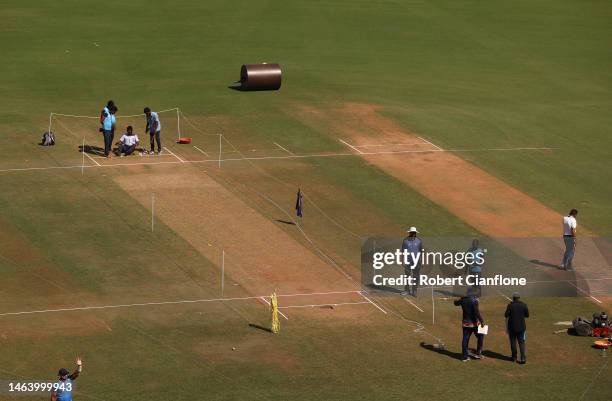 Groundskeepers are seen preparing the pitch prior to a Australia training session at Vidarbha Cricket Association Ground on February 08, 2023 in...