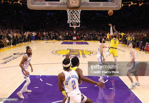 LeBron James of the Los Angeles Lakers scores on a jumper to pass Kareem Abdul-Jabbar to become the NBA's all-time leading scorer, surpassing...