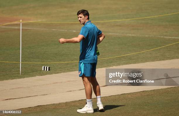 Pat Cummins of Australia inspects the pitch during a Australia training session at Vidarbha Cricket Association Ground on February 08, 2023 in...