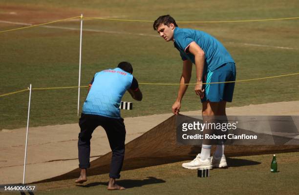 Pat Cummins of Australia inspects the pitch during a Australia training session at Vidarbha Cricket Association Ground on February 08, 2023 in...