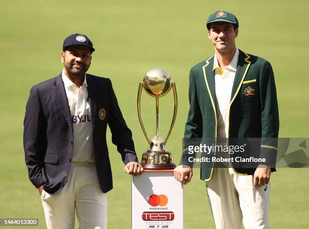 Rohit Sharma of India and Pat Cummins pose with The Border–Gavaskar Trophy during a media opportunity at Vidarbha Cricket Association Ground on...