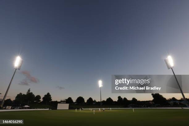 General view as the sun sets during day one of the Tour match between New Zealand XI and England at Seddon Park on February 08, 2023 in Hamilton, New...