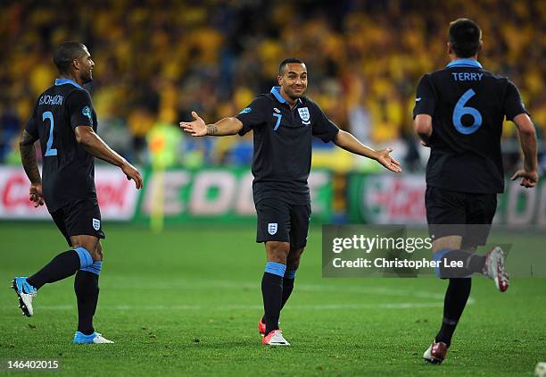 Theo Walcott of England celebrates scoring their second goal during the UEFA EURO 2012 group D match between Sweden and England at The Olympic...