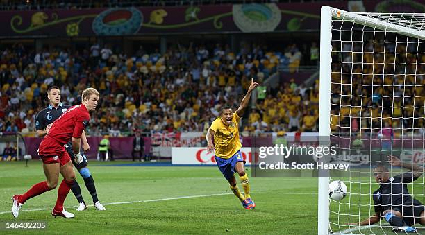 Martin Olsson of Sweden celebrates after Glen Johnson of England fails to stop Olof Mellberg of Sweden's goal during the UEFA EURO 2012 group D match...