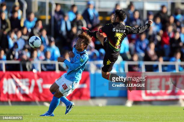 Yuto Sato of JEF United Chiba and Shinichi Terada of Yokohama FC compete for the ball during the J.League J1 promotion play-off semi final between...