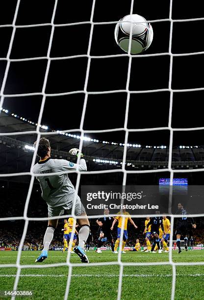 Theo Walcott of England scores their second goal past Andreas Isaksson of Sweden during the UEFA EURO 2012 group D match between Sweden and England...