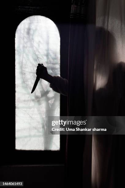 killer hiding behind the curtains. - murder victim stock pictures, royalty-free photos & images