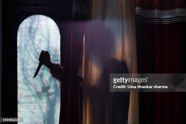 murderer hiding behind the curtains. - murder victim stock pictures, royalty-free photos & images