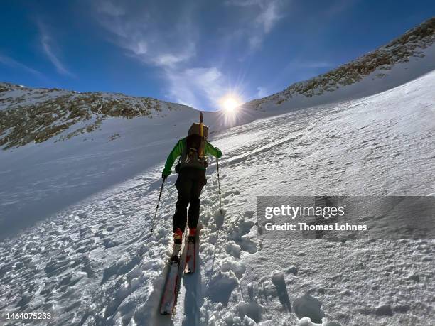 Ski tourer walks to the east grad to the Alpspitz during a winter ascent on January 30, 2023 in Garmisch-Partenkirchen, Germany. The Alpspitze is the...