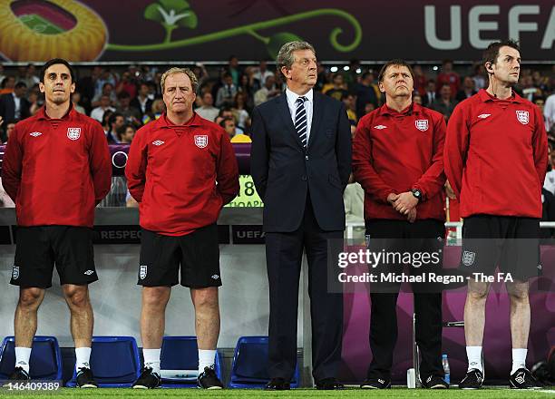 Manager Roy Hodgson of England with coaches Gary Neville and Ray Lewington during the UEFA EURO 2012 group D match between Sweden and England at The...