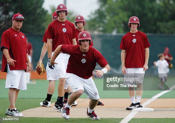 South Carolina's Joey Pankake heads home as the team practices the squeeze play during practice for the College World Series at Creighton University...