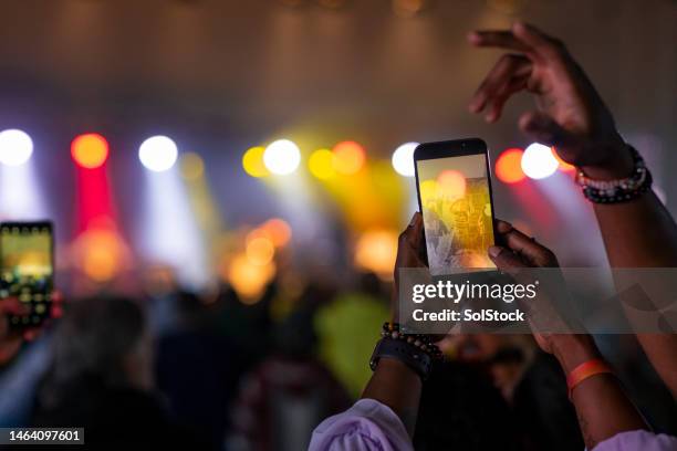 taking concert photo - photo messaging stock pictures, royalty-free photos & images