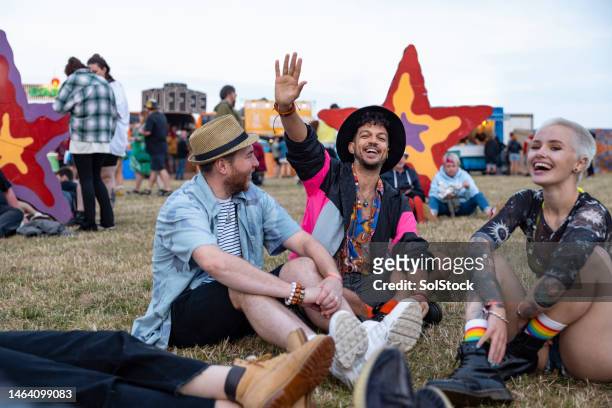 enjoying the festival - music festival grass stock pictures, royalty-free photos & images