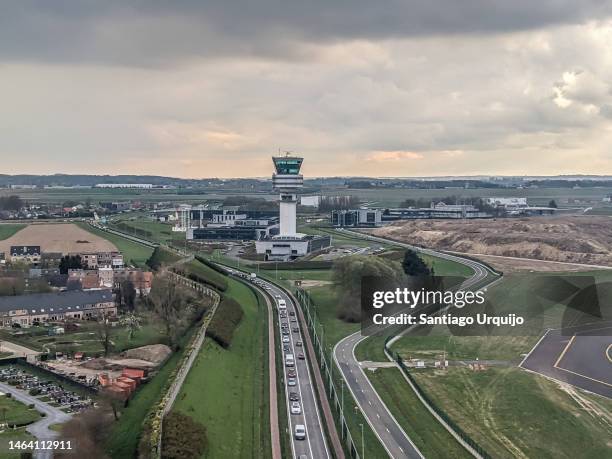 aerial view of air traffic control tower of brussels airport - zaventem stock-fotos und bilder