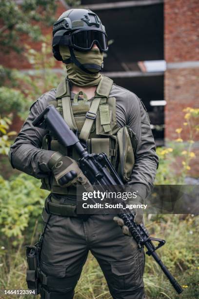 military man on a training ground - army helmet stockfoto's en -beelden