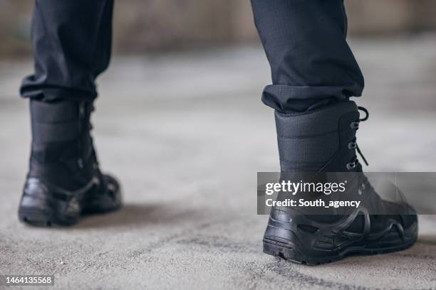 close-up of a military man's boots - boot spur stock pictures, royalty-free photos & images