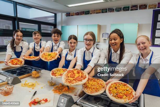 showing our pizzas - children cooking school stock pictures, royalty-free photos & images