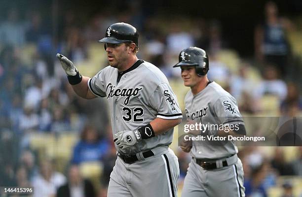 Adam Dunn of the Chicago White Sox jogs to the dugout after hitting a two-run home run in the first inning during the MLB game at Dodger Stadium on...