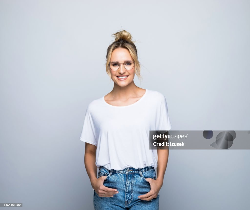 Happy beautiful blond woman wearing eyeglasses