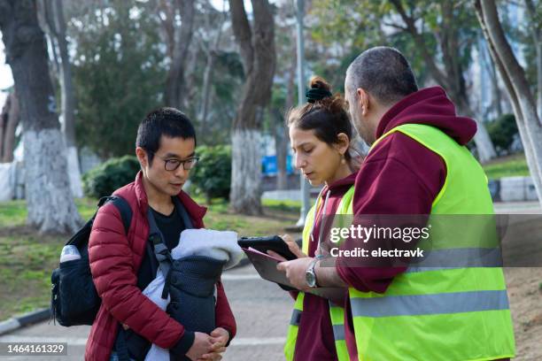 volunteers collecting signatures - sign petition stock pictures, royalty-free photos & images