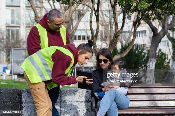 volunteers collecting signatures - petition stock pictures, royalty-free photos & images