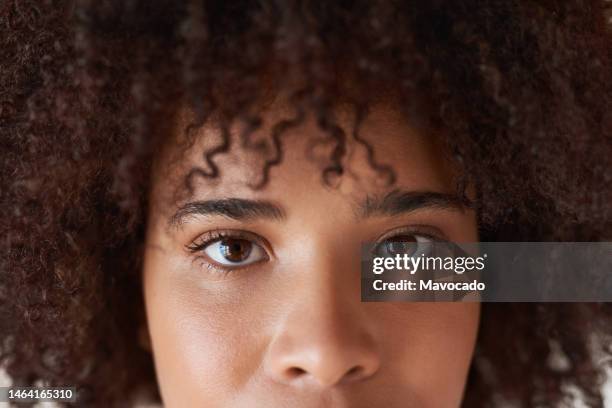 close-up of a young african woman's eyes - eye stock pictures, royalty-free photos & images