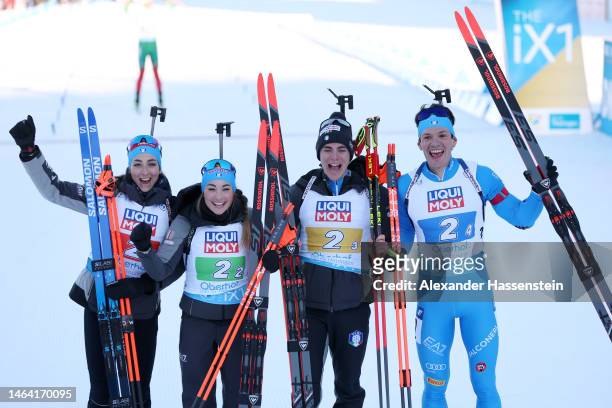 Lisa Vittozzi, Dorothea Wierer, Didier Bionaz and Tommaso Giacomel of Italy celebrate after coming second place during the Mixed Relay at the IBU...
