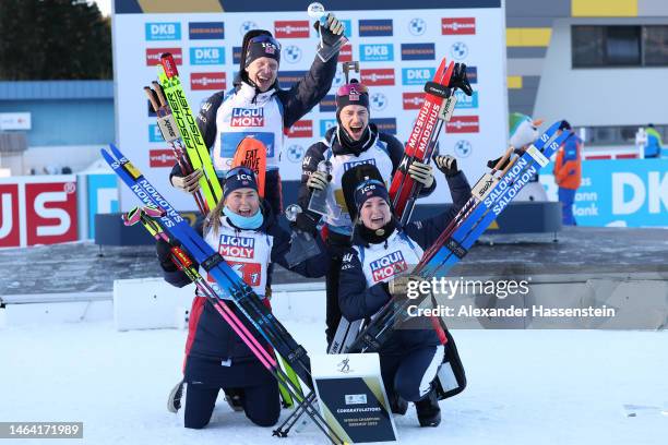 Gold medalists Ingrid Landmark Tandrevold, Marte Olsbu Roeiseland, Sturla Holm Laegreid and Johannes Thingnes Boe of Norway pose for a photo during...