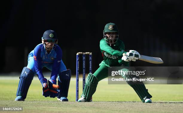 Nigar Sultana Joty of Bangladesh plays a shot as Richa Ghosh of India keeps during a warm-up match between Bangladesh and India prior to the ICC...