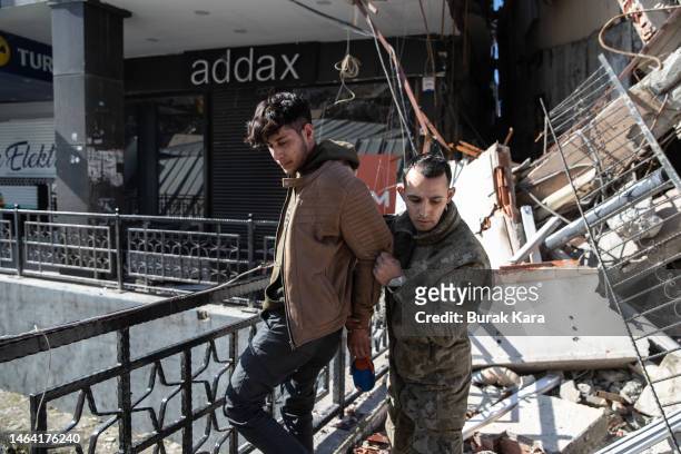 Soldier detains a looter on February 08, 2023 in Hatay, Turkey. A 7.8-magnitude earthquake hit near Gaziantep, Turkey, in the early hours of Monday,...