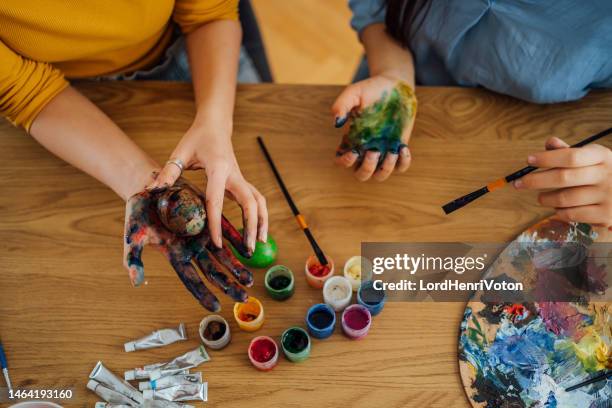 painting eggs for easter - female friendship painting stock pictures, royalty-free photos & images