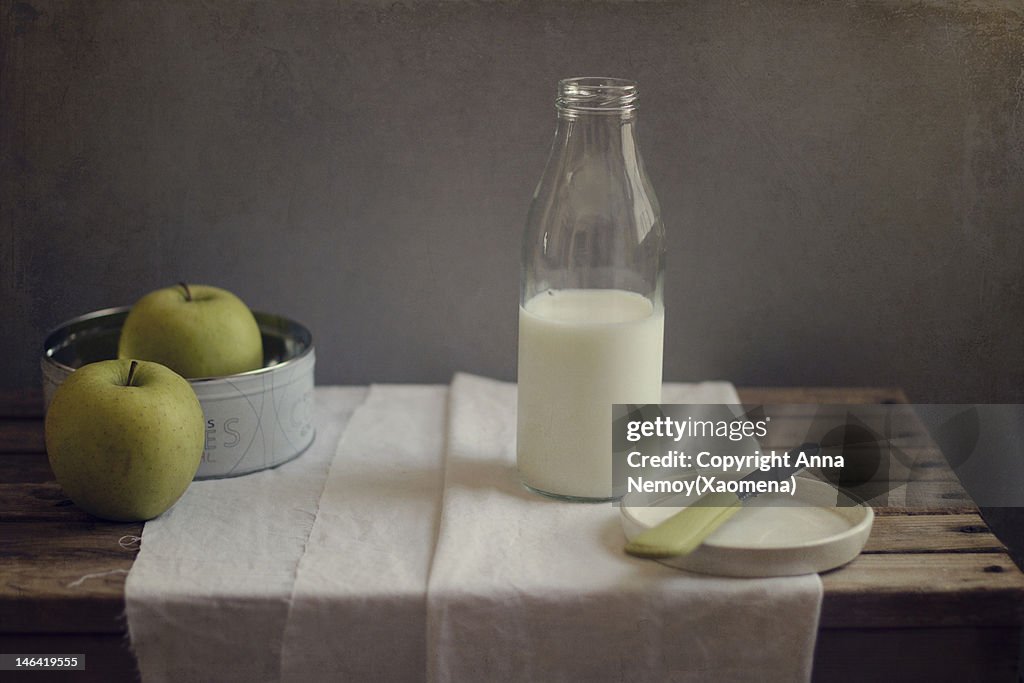 Bottle of milk and two apples