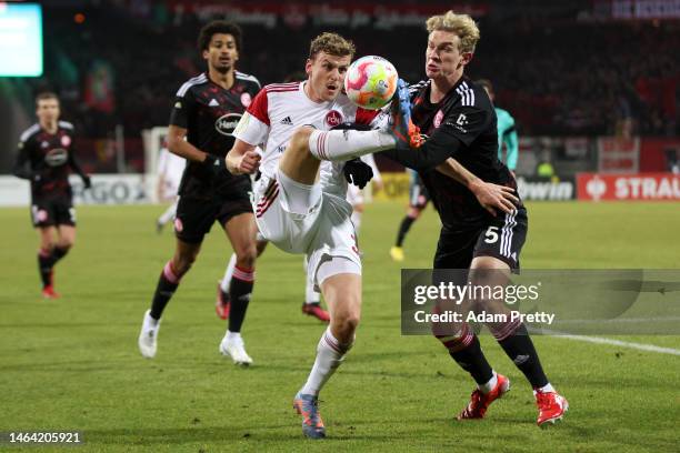 Christoph Daferner of 1. FC Nürnberg battles for possession with Christoph Klarer of Fortuna Düsseldorf during the DFB Cup round of 16 match between...