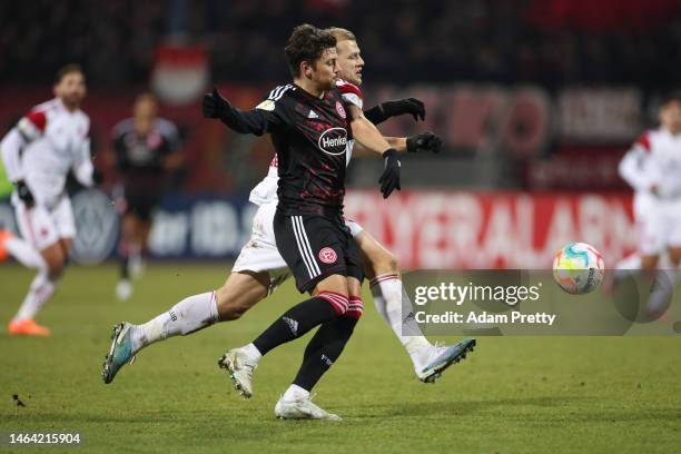 Dawid Kownacki of Fortuna Düsseldorf battles for possession with Johannes Geis of 1. FC Nürnberg during the DFB Cup round of 16 match between 1. FC...